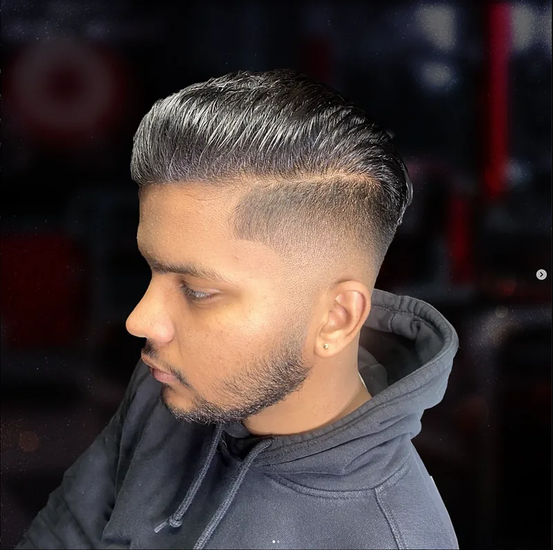 Skin fade with a hard part, side profile